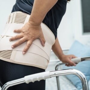 back brace, hand on back